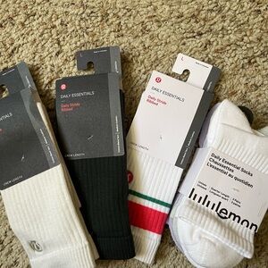 6 pairs Brand New Lululemon socks. 3 individual pairs and one 3pack.